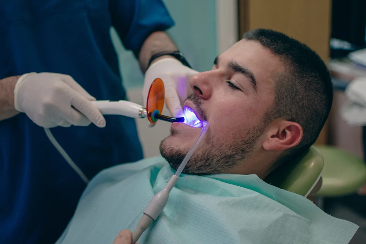 Close-up of composite bonding being applied to a front tooth
